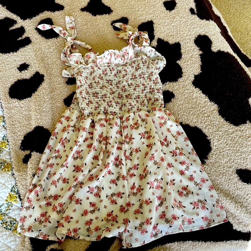 This is a romper in size medium purchased from Altar’d State.